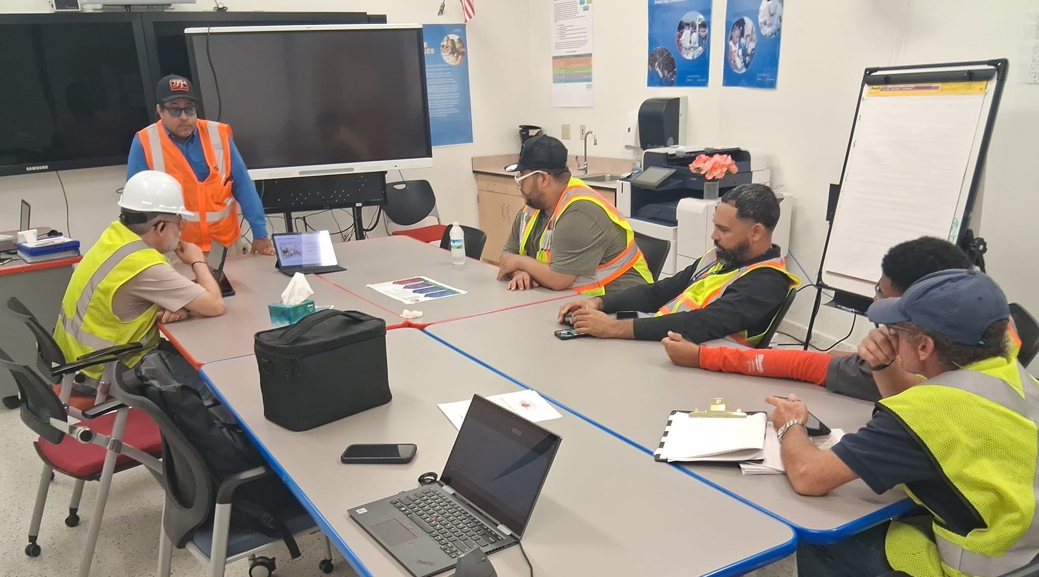 Project team leading an operational safety briefing